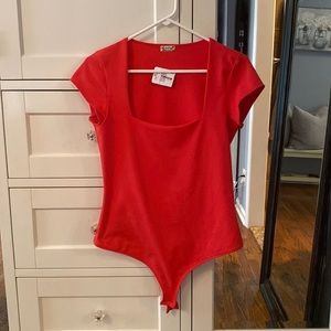 Bright red body suit